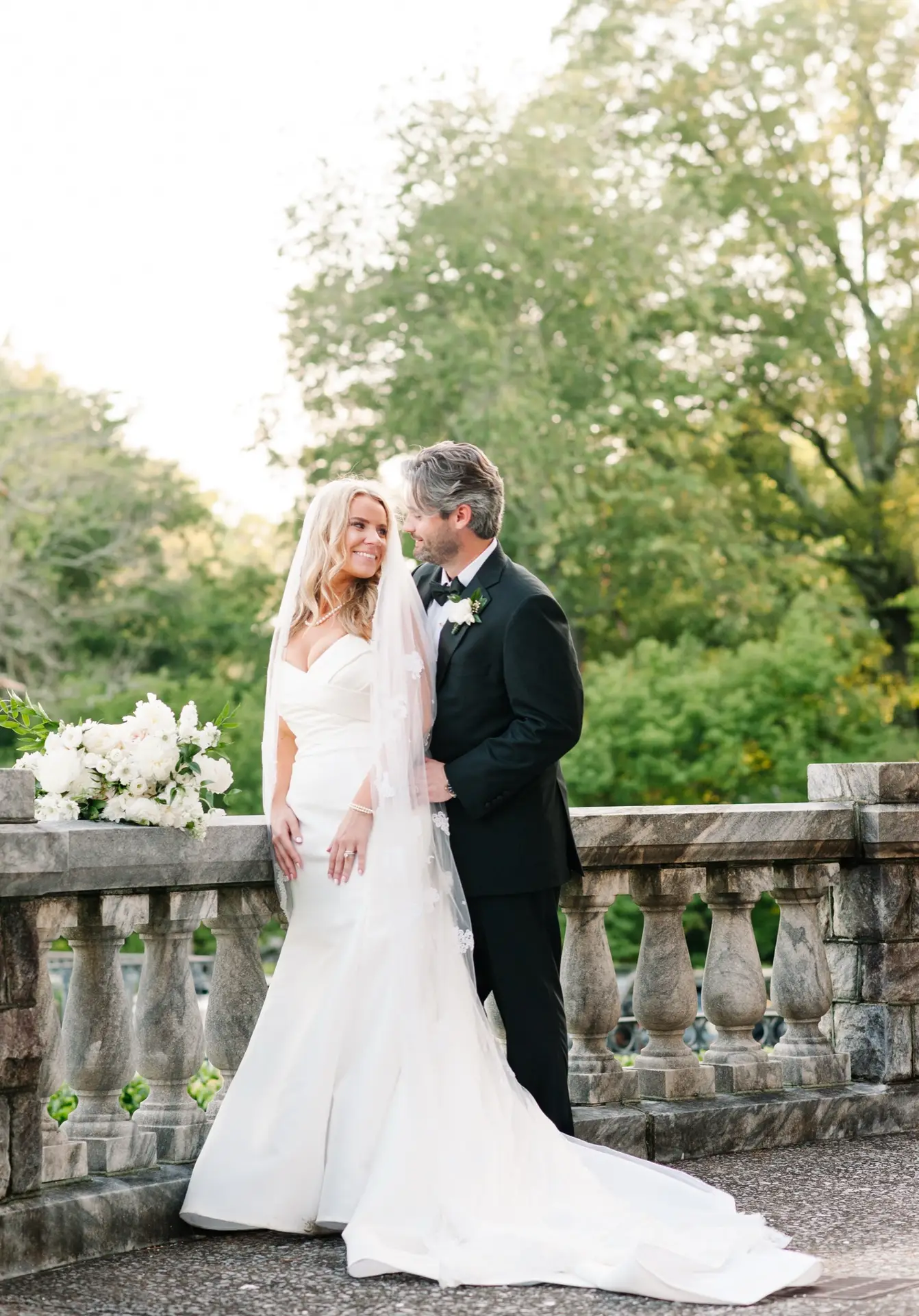 Lily Smith and groom in a garden, custom altered wedding gown by Margo West, Dallas TX