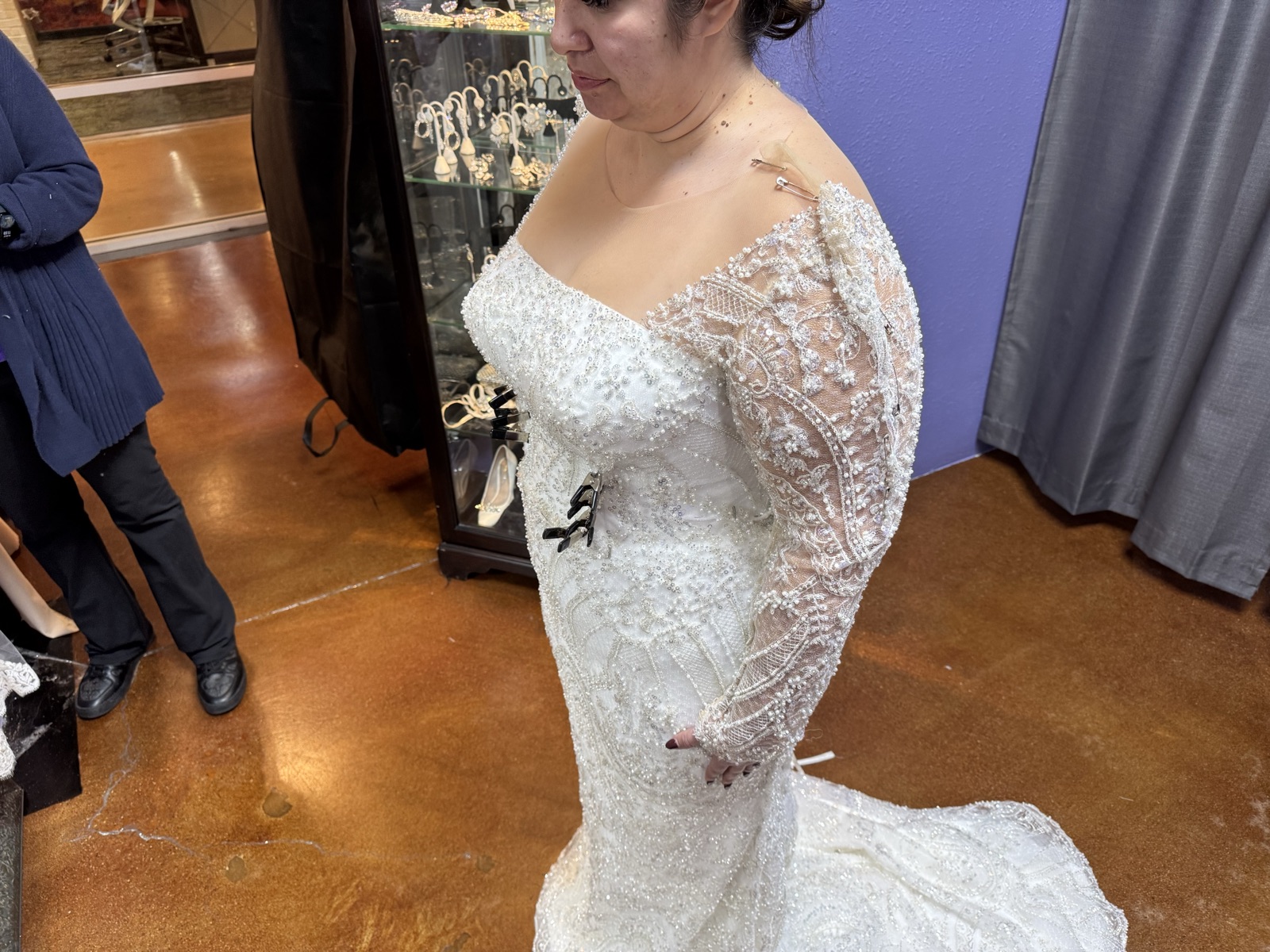 Bride in a beaded sheath wedding gown altered by Margo West Bridal Couture, Dallas TX