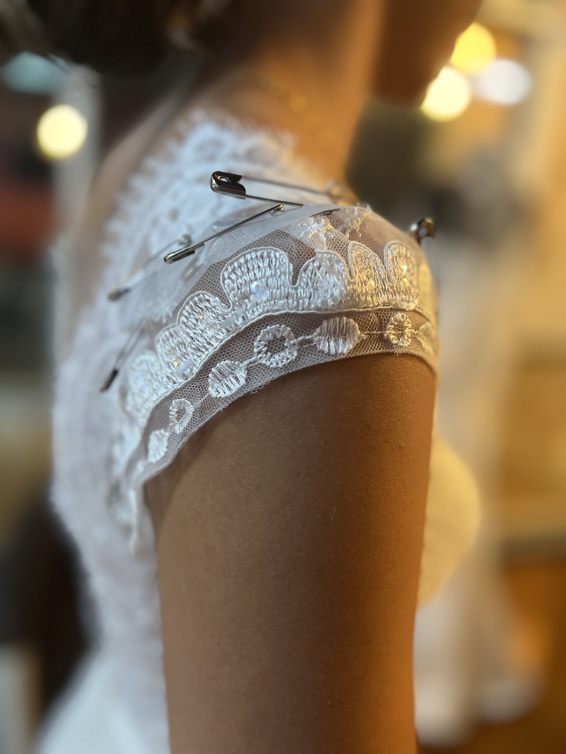 Custom neckline and strap addition to a wedding gown by Margo West Dallas TX